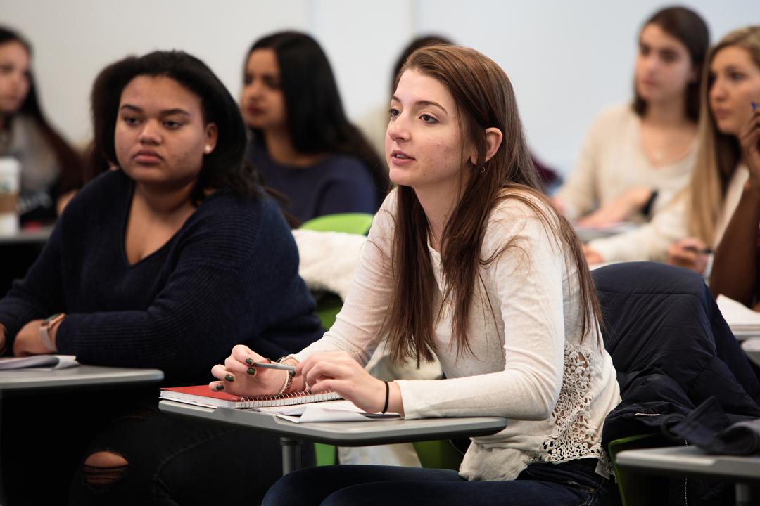 A small group of students in class sitting at desks